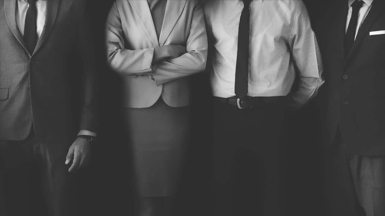 Classic black and white photograph featuring business individuals.