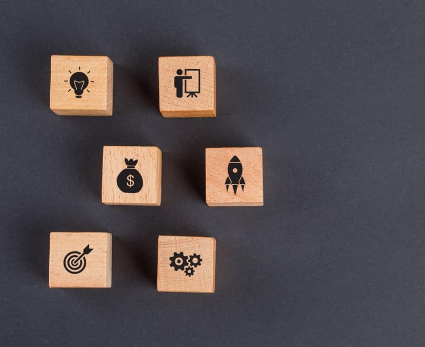Decorative wooden cubes adorned with different symbols