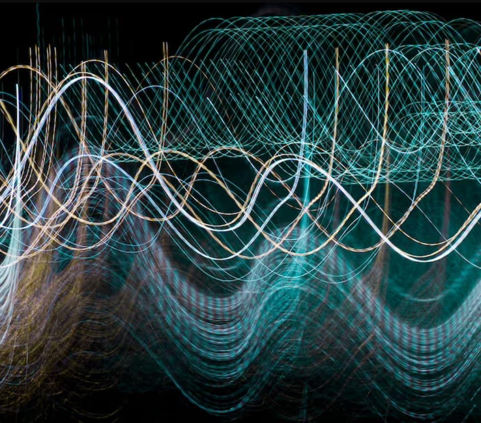 Abstract image of colorful waves and lights blending together in a mesmerizing display