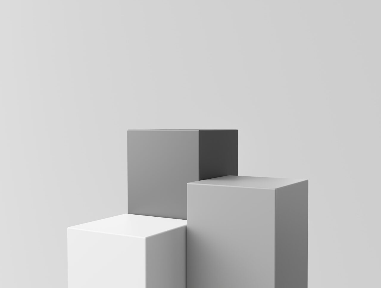 Three-dimensional cube on gray background.